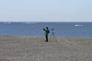 Matt Brown photographing at "the point," Gambell, AK